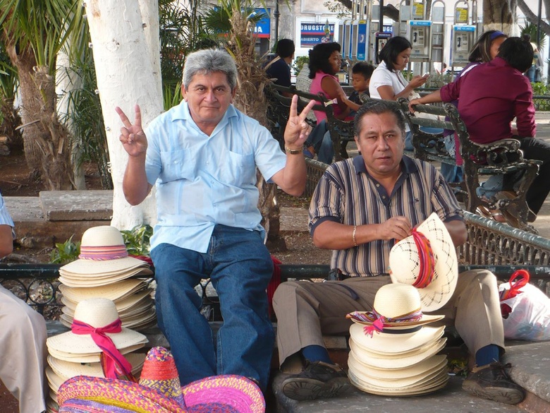 senores selling sombreros in Merida