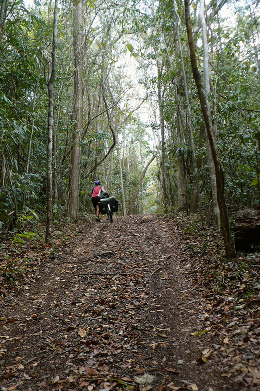 Kybi pushing his bike