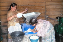 Maya women preparing tortillas