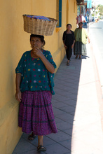 Maya women carrying something on her head