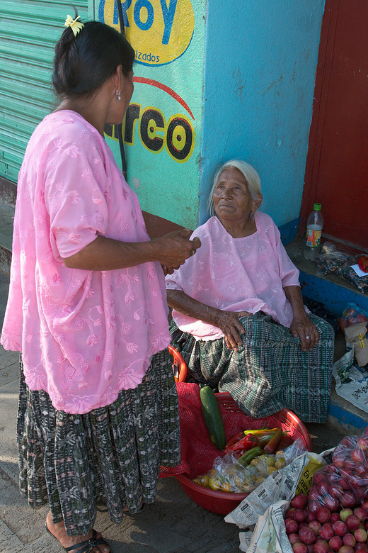 Old Maya woman selling vegetables in Coban