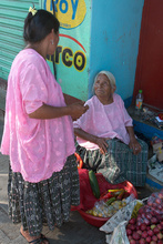 Old Maya woman selling vegetables in Coban