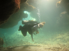 Andrea in a small cave, Underwater world by Dasa, Utila