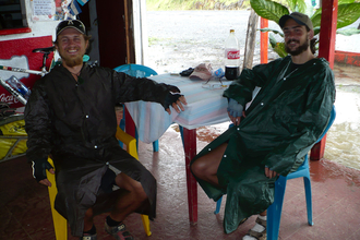 Clement and Kybi in raincoats
