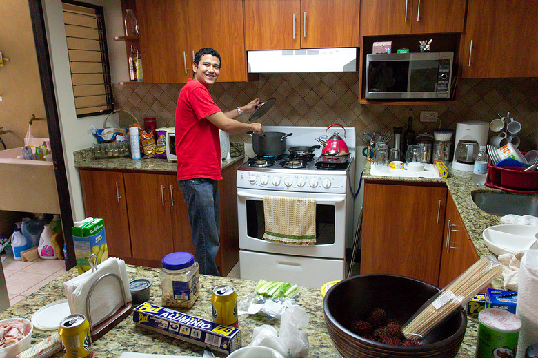 Jorge cooking in his sister's kitchen, San Jose,  Costa Rica