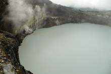 Boiling lake in the bottom of the active crater