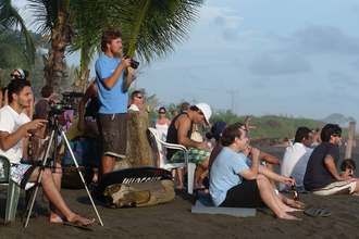 Watching a surfing competition, Playa Hermosa, Costa Rica